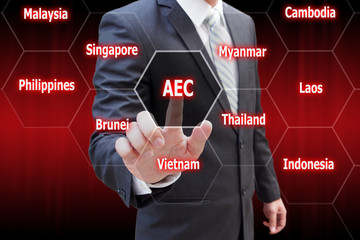 Businessman hand touching virtual panel of AEC (Asean Economics Community) , Business concept
