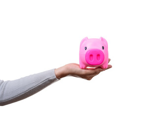 Female holding a pink piggy bank isolated