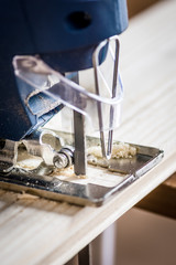 Carpenter sawing wood