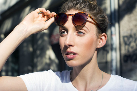 Portrait of young woman with sunglasses