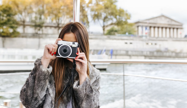 Paris, France, tourist taking picture with camera on Seine River