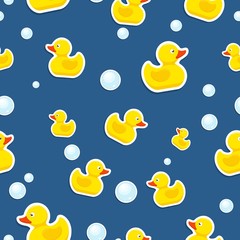 Rubber duck and bubbles seamless pattern bath toy on blue background. Vector illustration