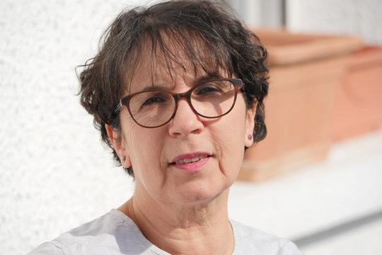 portrait of brunette mature woman with glasses