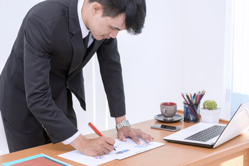 Young businessman working on a table