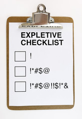 Expletive checklist clipped to clipboard. Emotional concept. Fun. Humor.