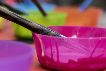 paints and brushes used to paint a picture