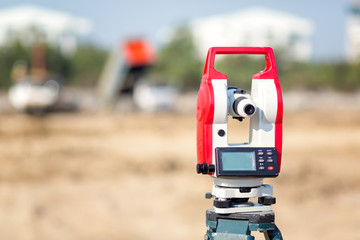 Surveyor equipment tacheometer or theodolite outdoors at construction site for civil engineer...