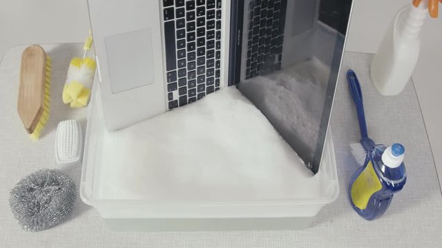 A Mac book get the final wash cycle, It symbolizes recycling and the best service for electronics and computers, but it also stands for the safe handling of data and the data loss and the restoration.