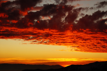 Colorful fiery sunset over the mountains