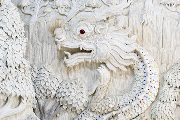 Stucco of Chinese dragon in the wall of Thai temple.