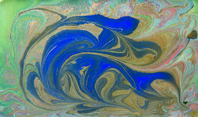 Green and blue liquid texture. Hand drawn marbling background. Ink marble abstract pattern