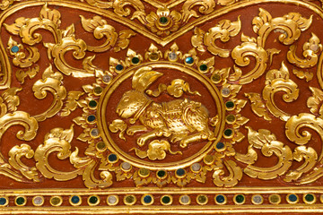 Golden stucco of ancient Thai pattern in the temple.