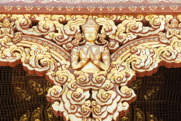 Golden stucco of the angle in Thai temple.