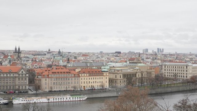 Tilting on Czechia capital Vltava river 4K 2160p 30fps UltraHD footage - Prague cityscape and rooftops by the day slow tilt 3840X2160 UHD video 