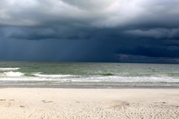 The white and dark clouds over the sea.
