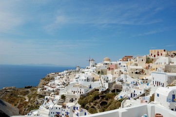 Fototapeta na wymiar Santorini - the volcano among the Cyclades, Aegean sea. Island's capital, Fira, which is situated on the edge of a cliff. Known for distinctive architecture in white and blue colours