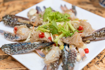 thai style raw spicy blue swimmer crab salad served with seafood sauce
