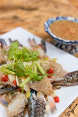 thai style raw spicy blue swimmer crab salad served with seafood sauce