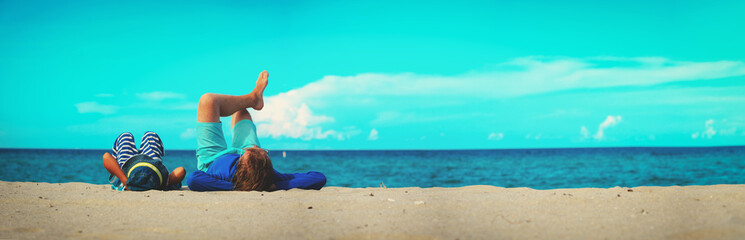 father and son having fun on the beach