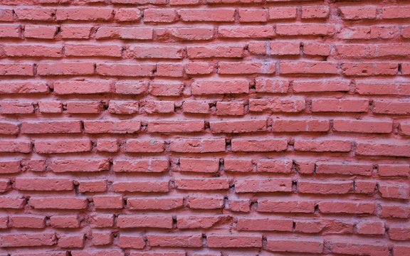 Empty red brick wall textured background.