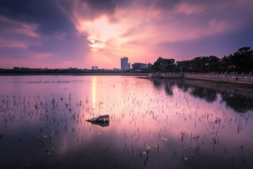 Tranquil lake under sunset
