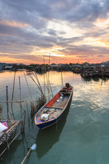 Fototapeta premium fishing boats at fisherman village with nice sky
