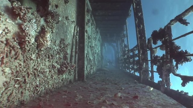 Deck of ship wrecks Salem Express underwater in the Red Sea in Egypt.Extreme tourism on the ocean floor in the world of coral reefs, fish, sharks. Researchers of wildlife blue abyss. Deep diving.