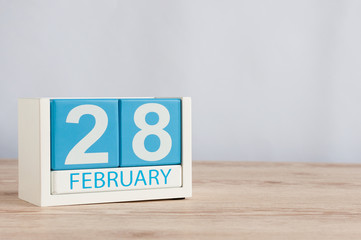 February 28th. Cube calendar for february 28 on wooden surface with empty space For text. Not Leap year or intercalary day