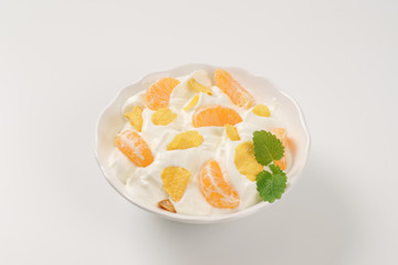 sour cream with fresh tangerine