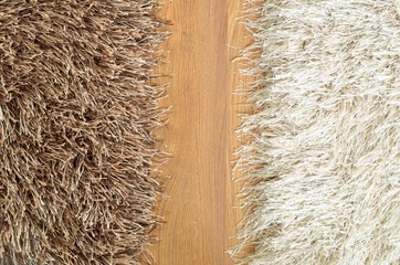 Brown and white hairy carpets divide in half and floating floor