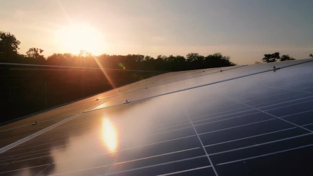 Solar panels with sunrise time lapse