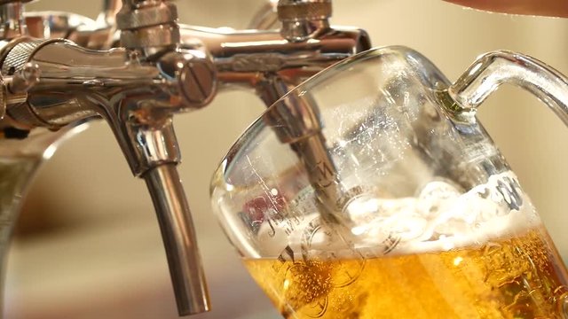  beer is poured into a large glass glass