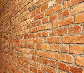 Old red brick wall for background