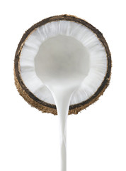 Coconut milk pouring front view isolated on white background