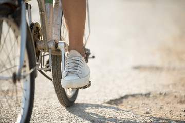 Leg woman on bicycle in road