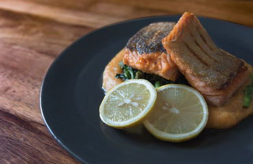 Pan seared salmon with potato puree and young broccoli