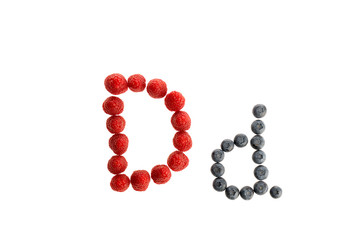 Alphabet from fresh fruit, raspberry and blackberry