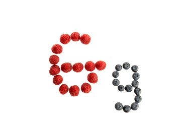 Alphabet from fresh fruit, raspberry and blackberry