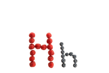 Alphabet from fresh fruit, raspberry and blackberry