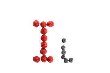 Alphabet from fresh fruit, raspberry and blackberry
