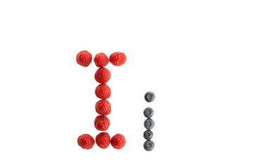 Alphabet from fresh fruit, raspberry and blackberry
