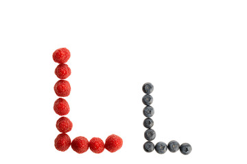 Alphabet from fresh fruit, raspberry and blackberry