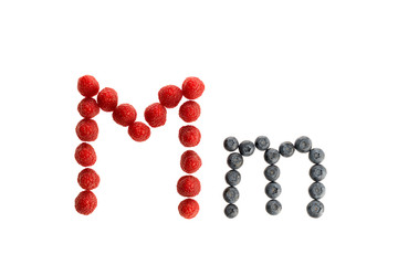 Alphabet from fresh fruit, raspberry and blackberry