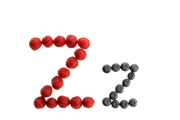 Alphabet from fresh fruit, raspberry and blackberry