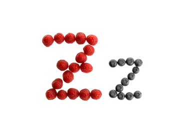 Alphabet from fresh fruit, raspberry and blackberry