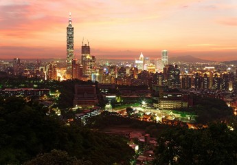 Fototapeta na wymiar Aerial panorama of downtown Taipei City with Taipei 101 Tower among skyscrapers under dramatic sky ~ A romantic evening in Taipei, the capital city of Taiwan, with beautiful rosy afterglow at sunset