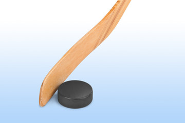 Ice hockey stick and puck