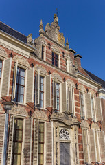Old decorated facade with blinds in Groningen