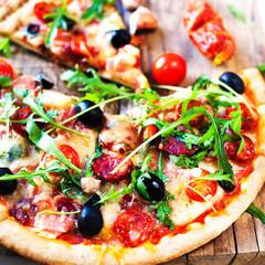 Delicious italian pizza served on wooden table close up, ihot and fresh