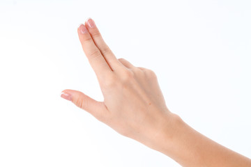 female hand showing the gesture with three straight fingers isolated on white background